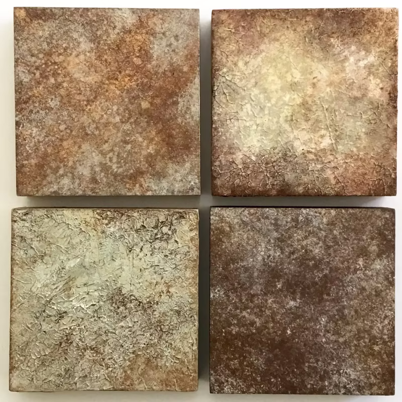 Four painted blocks, exploring the colors and textures of river debris.