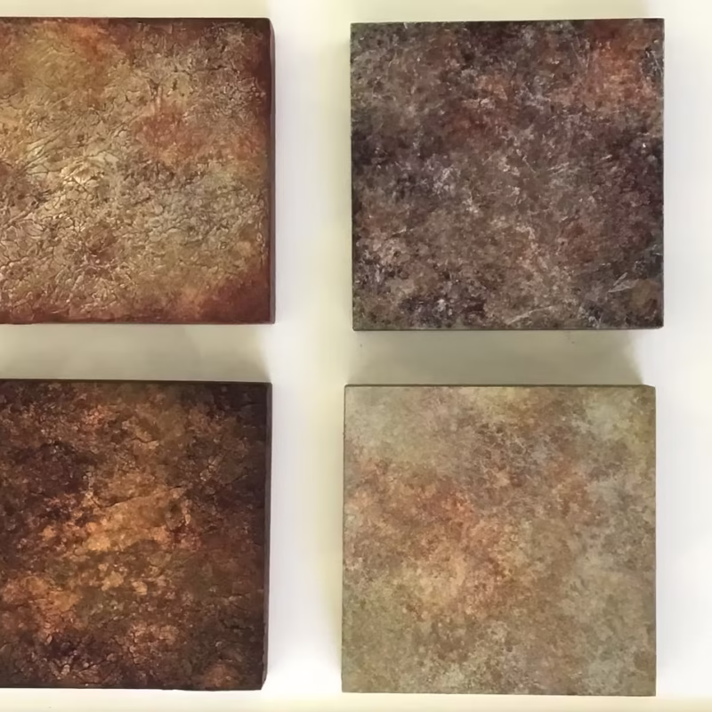 Four painted blocks exploring the colors and textures of forest duff